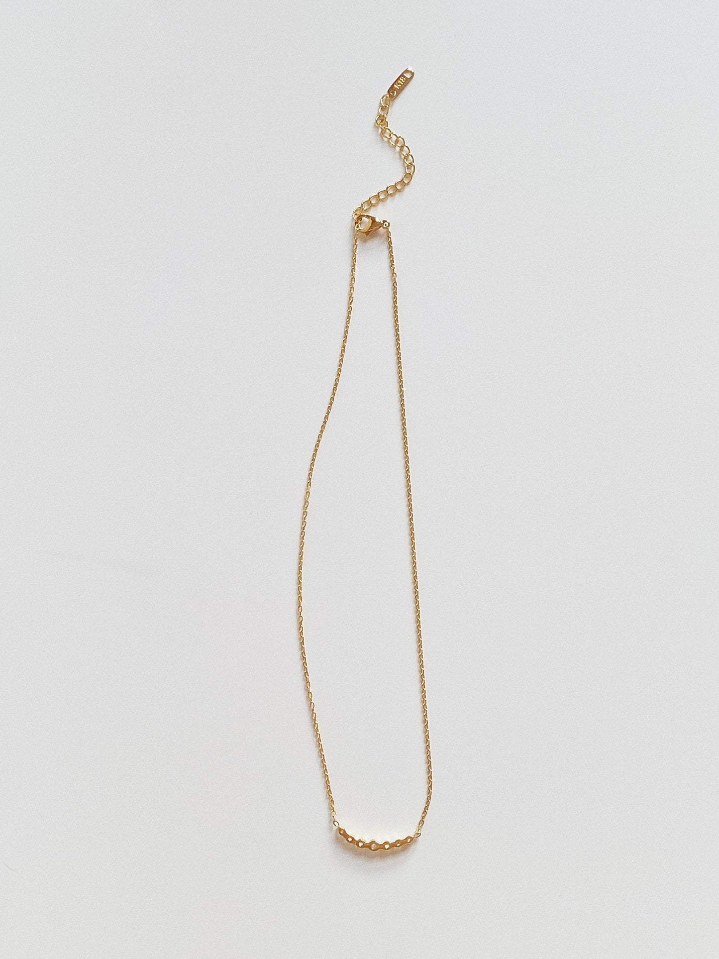 Back view of gold chain necklace showing 5cm adjustable extender and clasp.