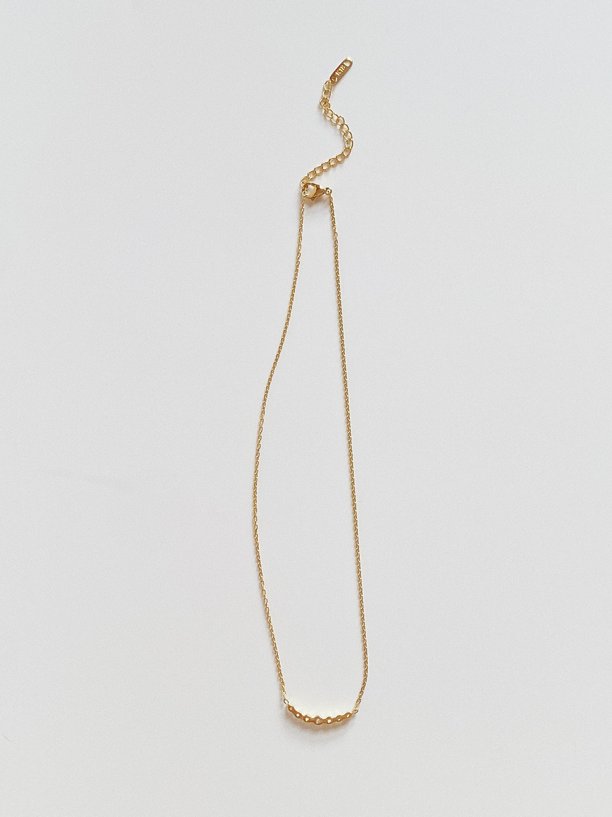 Back view of gold chain necklace showing 5cm adjustable extender and clasp.