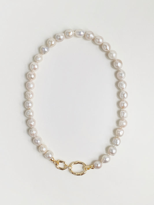 Grand Baroque freshwater pearl necklace with hammered gold double-link front clasp flat lay by Deja Vu Jewellery