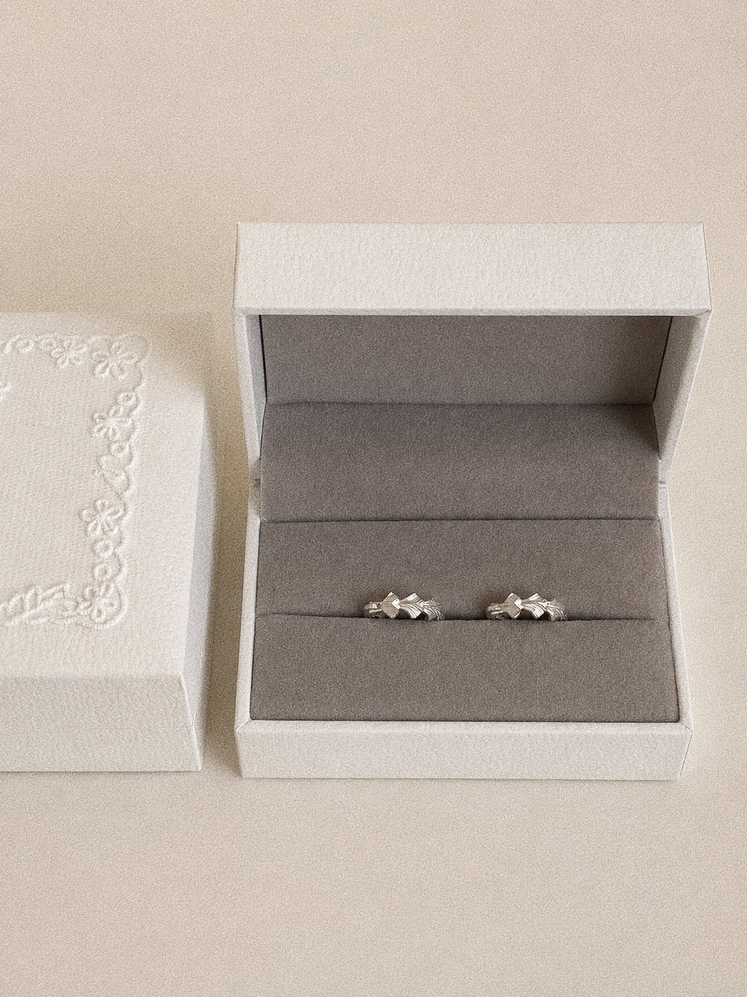 Grove sterling silver leaf hoop earrings presented as a pair in a Deja vu Jewellery gift box.