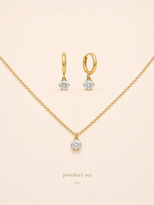 Icon jewellery set with the six claw cz solitaire necklace and matching huggie hoop earrings in 18k gold