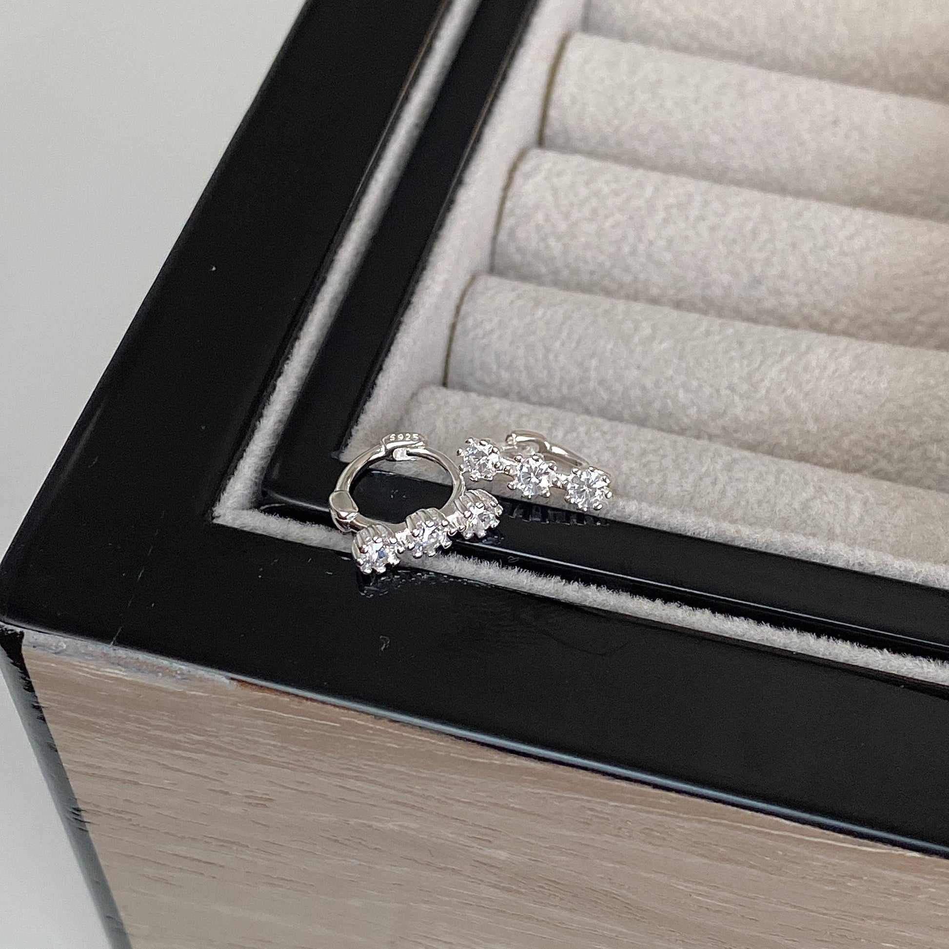 Tri-Sparkle S925 Silver Dainty Hoop Earrings on jewellery box