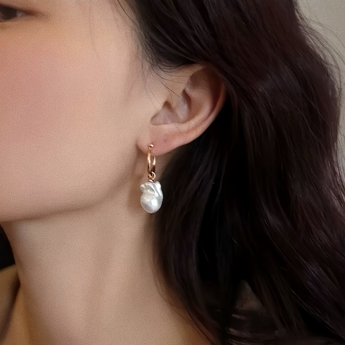 Model wearing the large baroque pearl drop earrings, showing the 13mm size and elegant dangle effect.