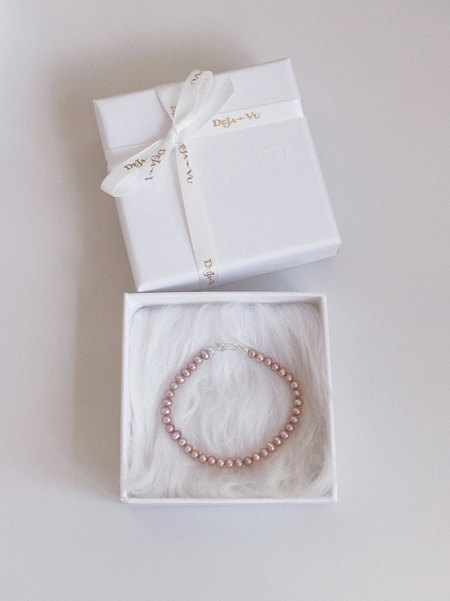 Natural lavender freshwater pearl bracelet presented in a Deja Vu Jewellery white gift box with logo ribbon