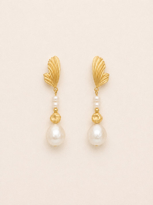 Linden long baroque pearl drop earrings with sculpted gold leaf studs, petite pearl accents and 11 mm freshwater pearls.