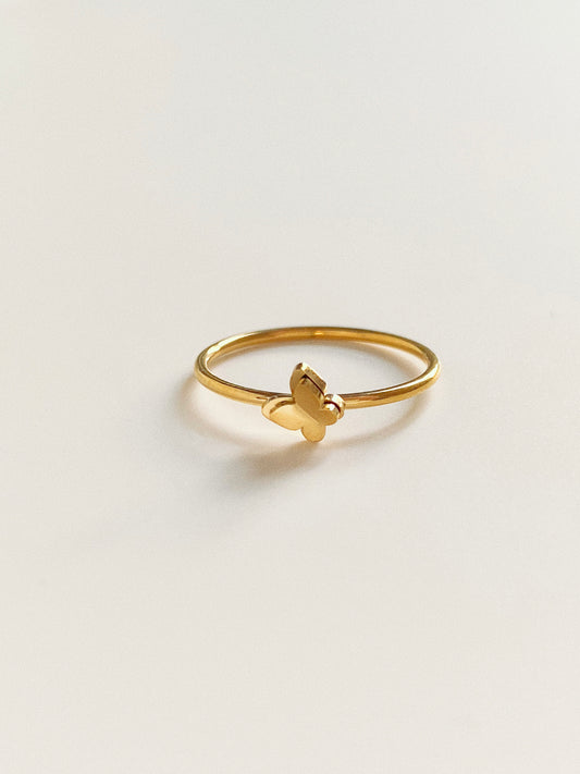 A minimalist gold butterfly ring made of durable titanium steel, featuring a polished butterfly charm on a slim band.