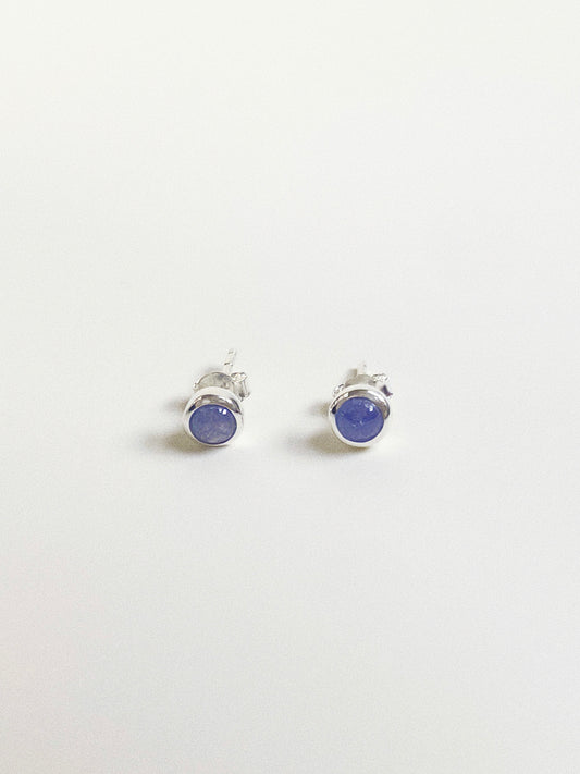 Pair of round 5-6mm natural Tanzanite cabochon stud earrings in sterling silver bezel setting.
