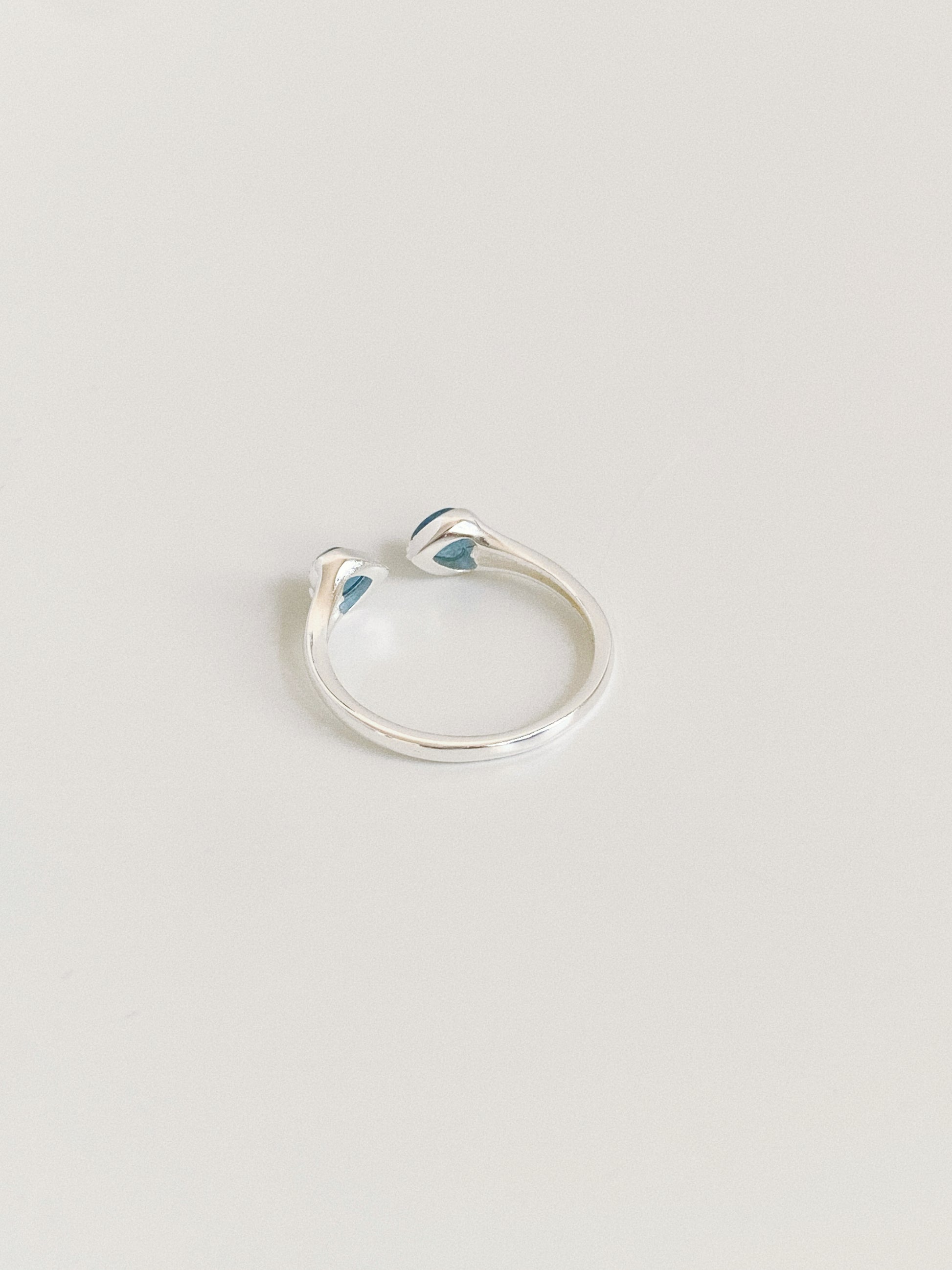Back view of the adjustable open band sterling silver ring showing the flexible gap construction