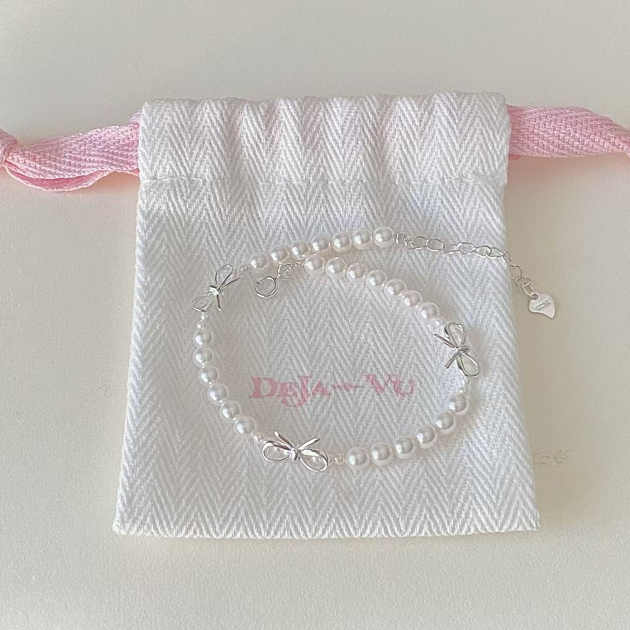 Dainty bow pearl bracelet close-up for bridesmaid gift