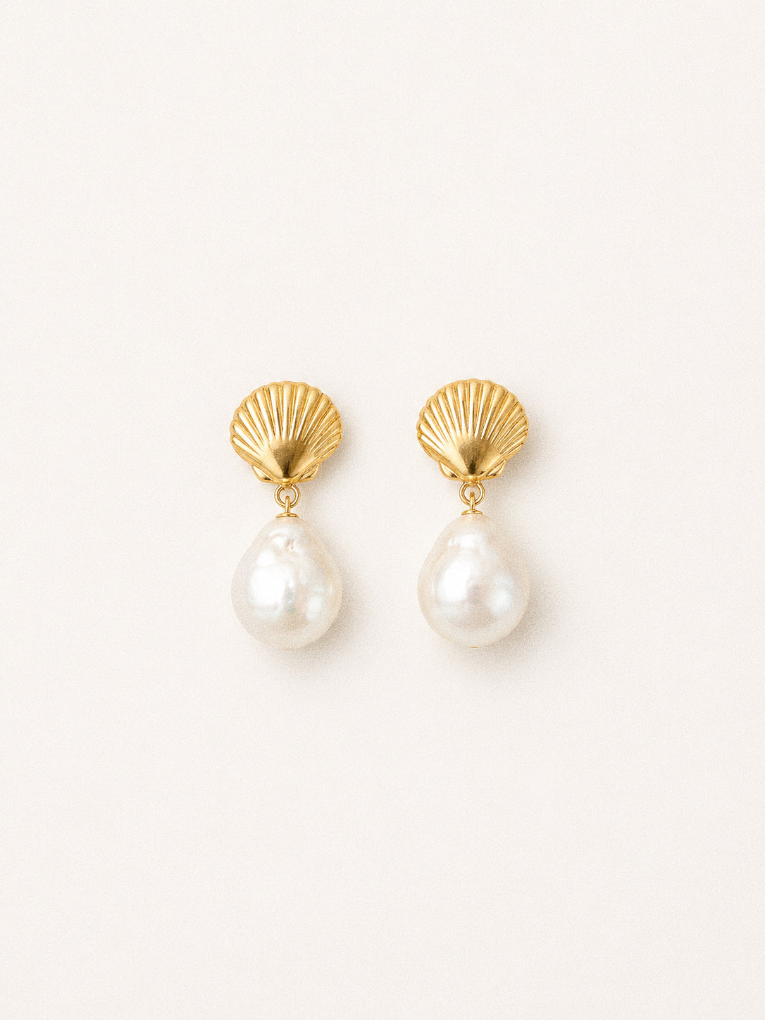 Shore freshwater Edison baroque pearl earrings with gold-plated shell studs and high-lustre white pearl drops.