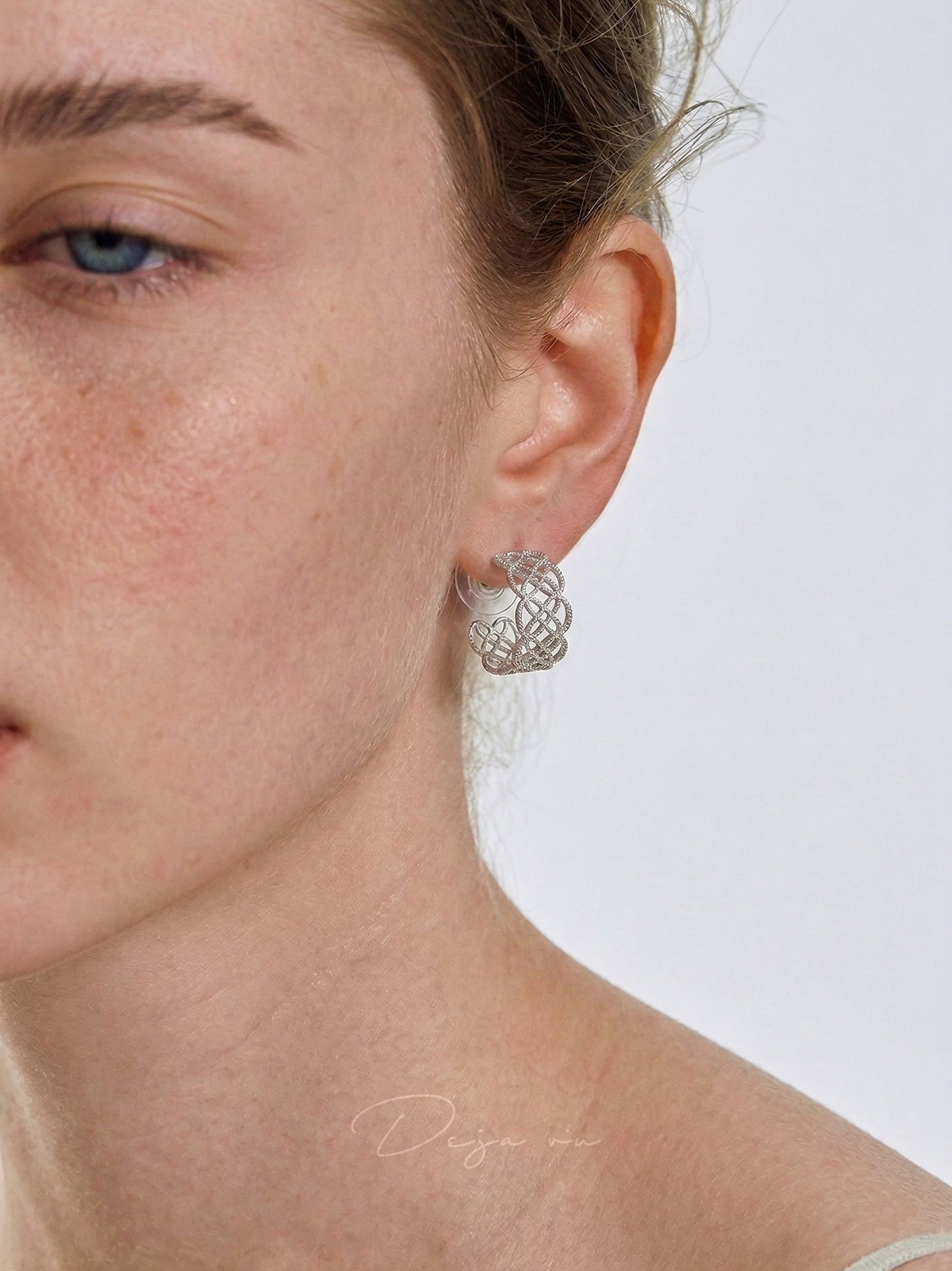 A model wearing the silver Arabesque Petal Lace Hoops, showing the 19mm scale and fit.