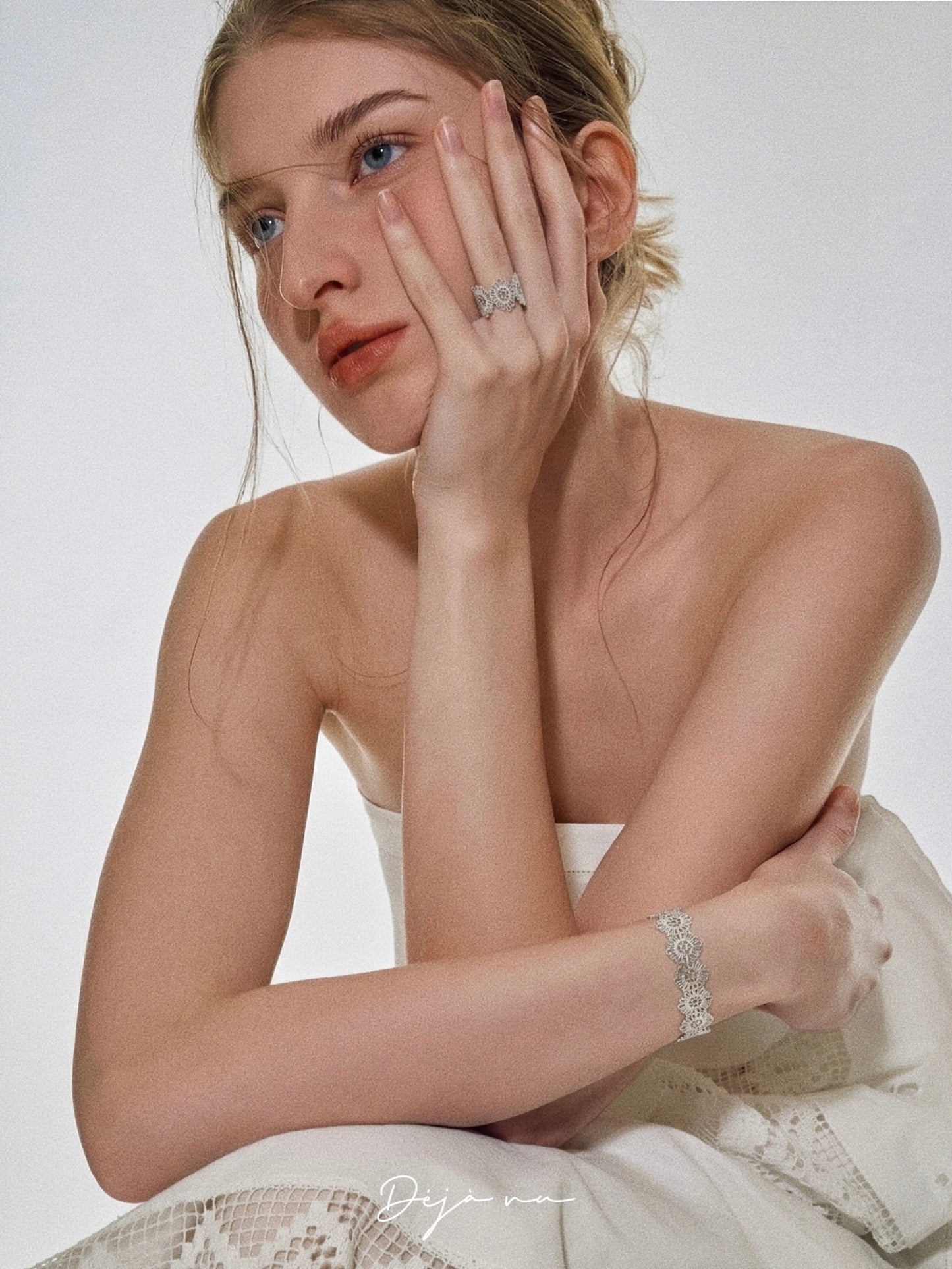 Silver vintage lace ring and matching lace bracelet styled on model in Deja Vu Jewellery campaign shot