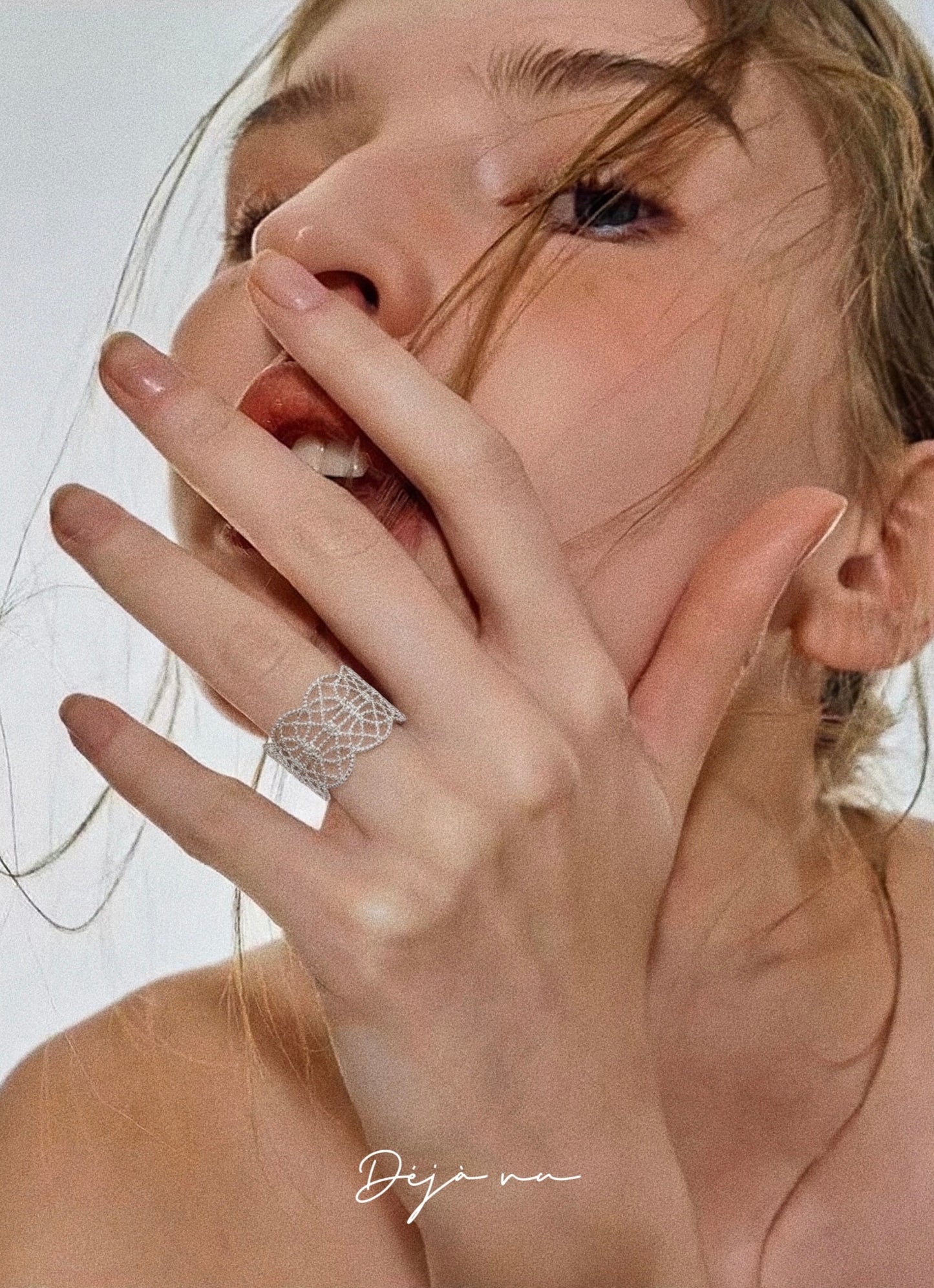 A model showcasing the silver lace ring, demonstrating its sophisticated fit and 9mm width.