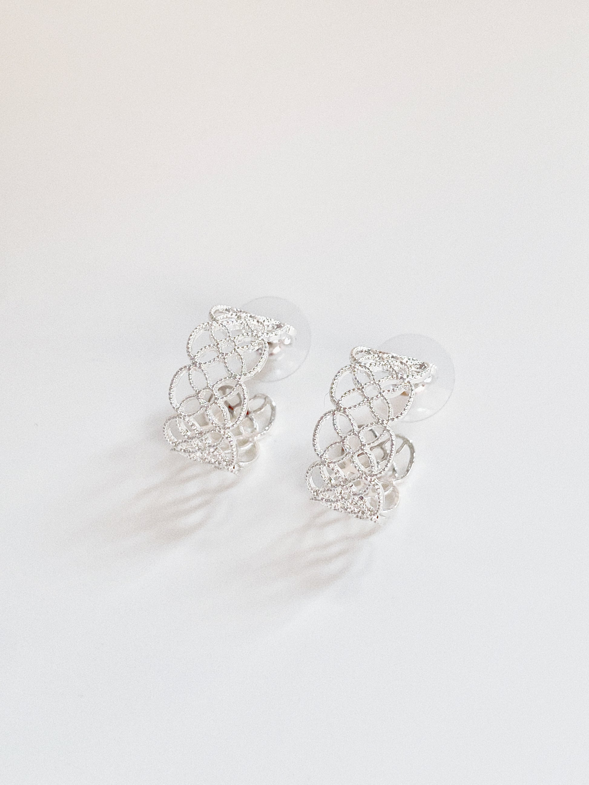 The sterling silver version of the Arabesque Petal hoops, perfect for a modern minimalist look.