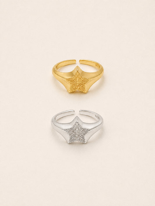 Nova star signet rings in 18k gold plated and sterling silver, engraved sunburst stars on open adjustable bands.