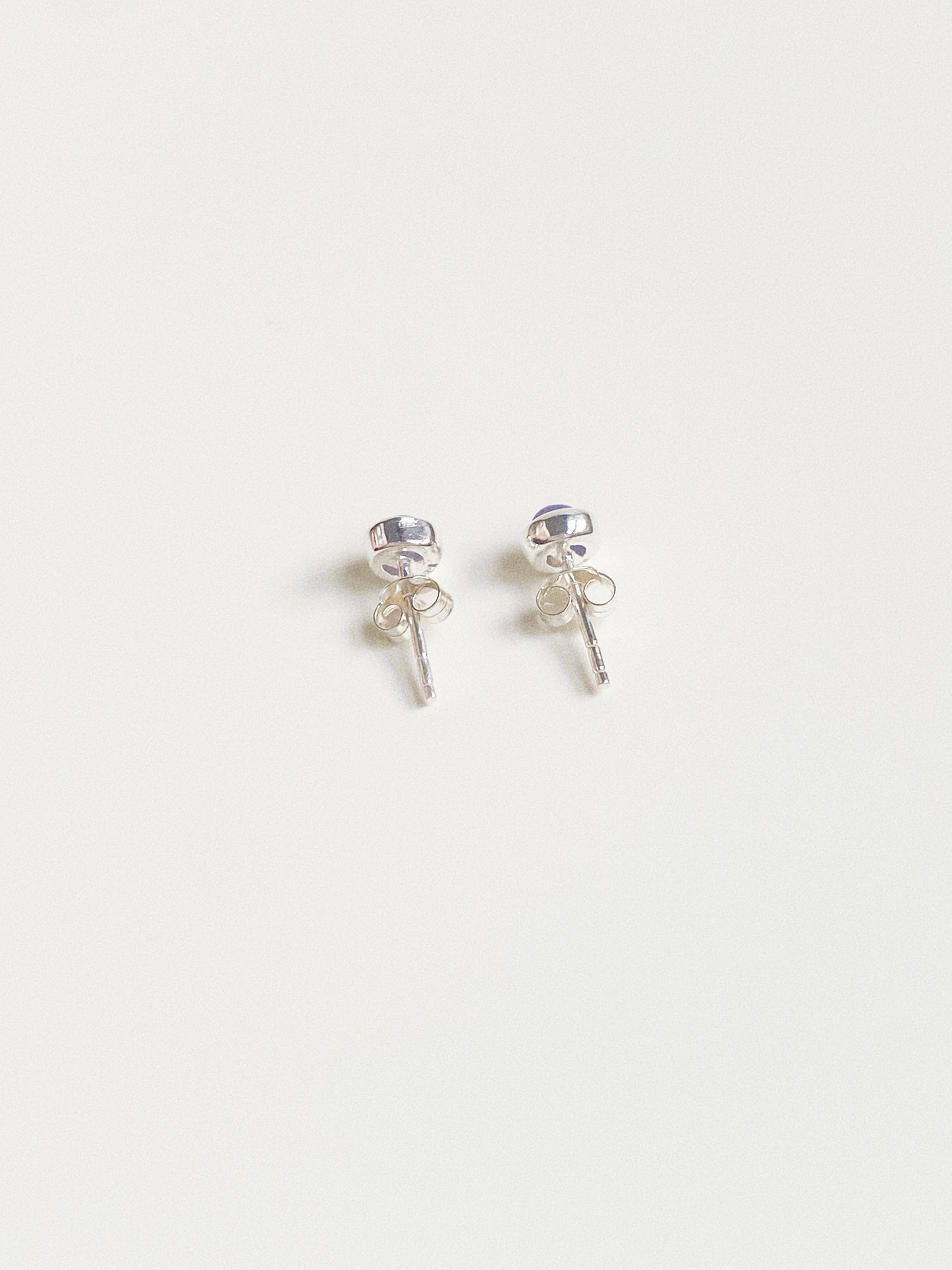 Back view of the earrings showing the 925 sterling silver posts and secure butterfly backs.