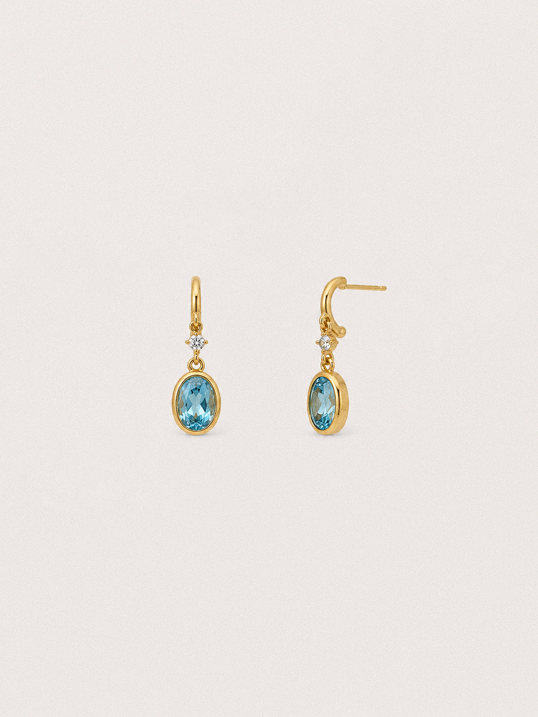 Tide Swiss blue topaz drop earrings in gold-plated 925 sterling silver with oval stones and clear accents.