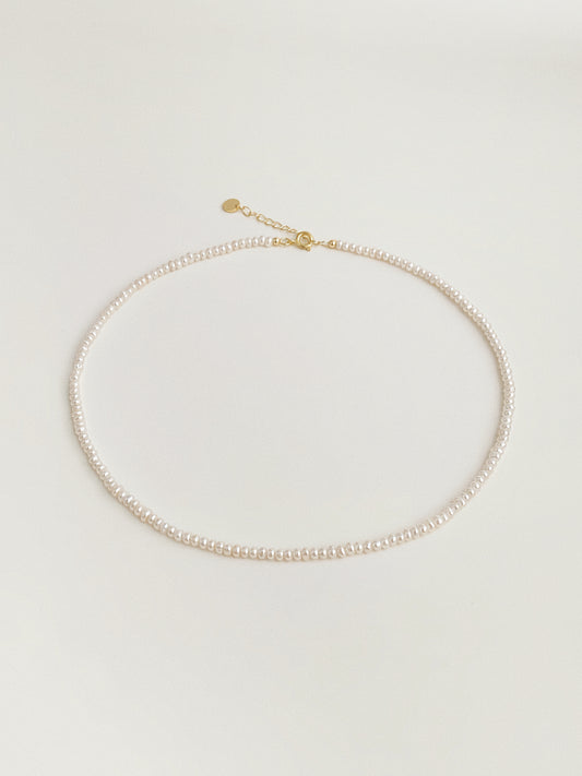 Tiny freshwater pearl choker necklace with gold spring clasp and extension chain by Deja Vu Jewellery