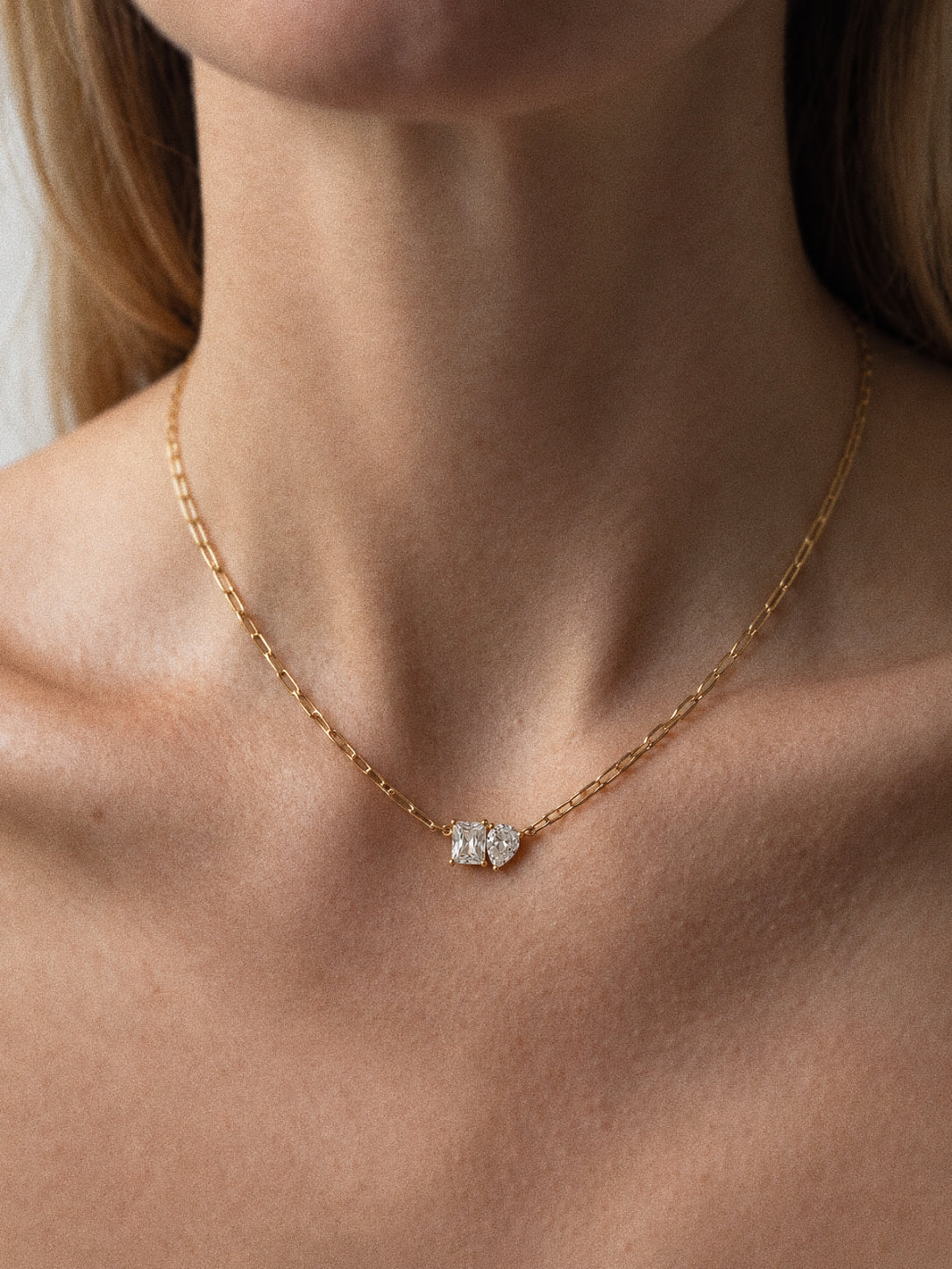 Toi et Moi two stone necklace worn alone, showing the gold paperclip chain and side-by-side clear stones.