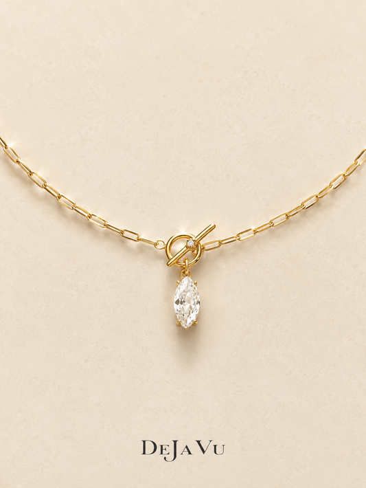 Gold paperclip chain necklace with a front toggle clasp and marquise cut cubic zirconia drop, waterproof titanium steel by Deja Vu