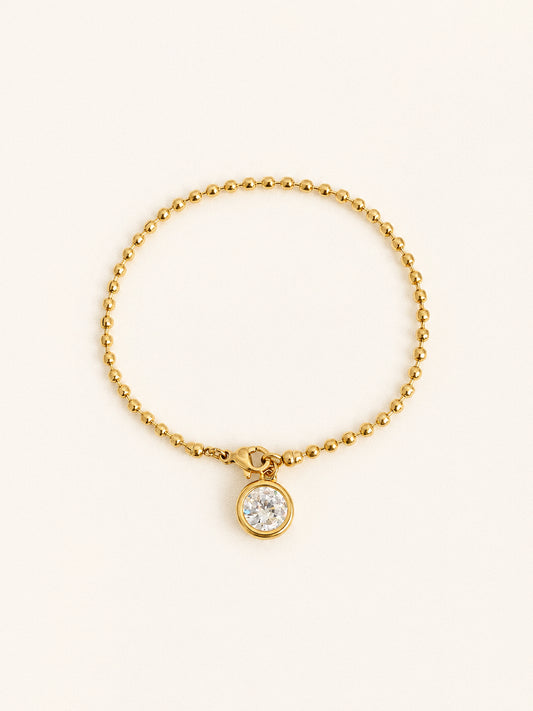 Aura waterproof ball chain bracelet in 18k gold with a 2 carat bezel set cubic zirconia charm at the clasp