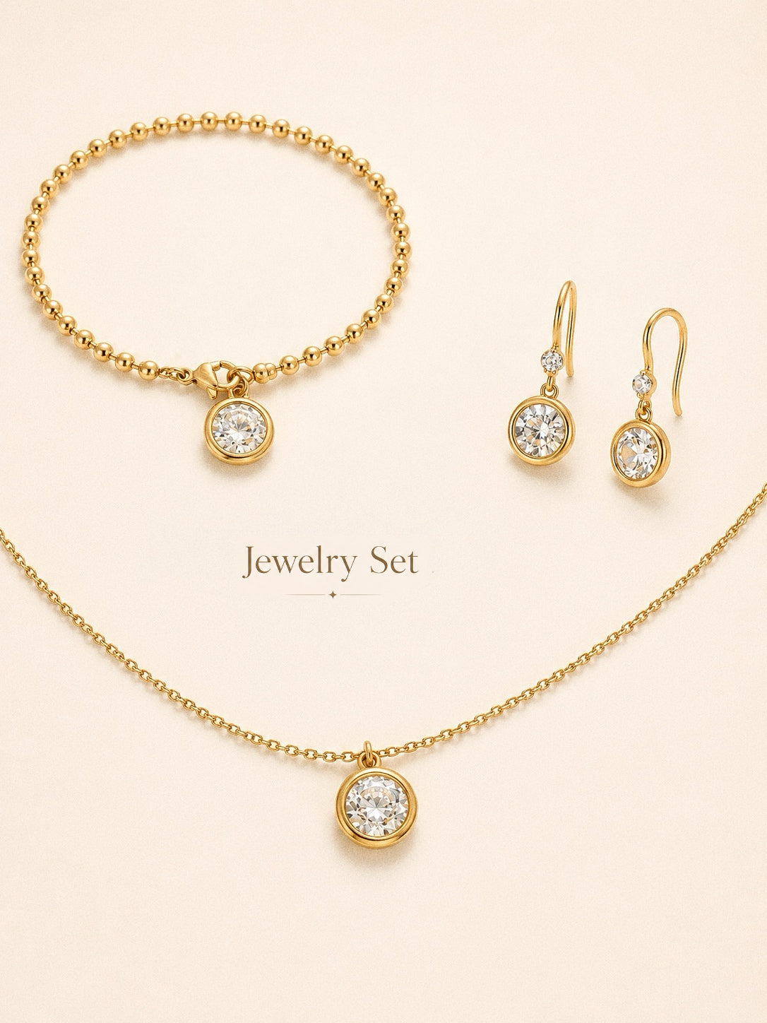 Aura waterproof jewellery set with matching CZ necklace, drop earrings and ball chain bracelet in 18k gold