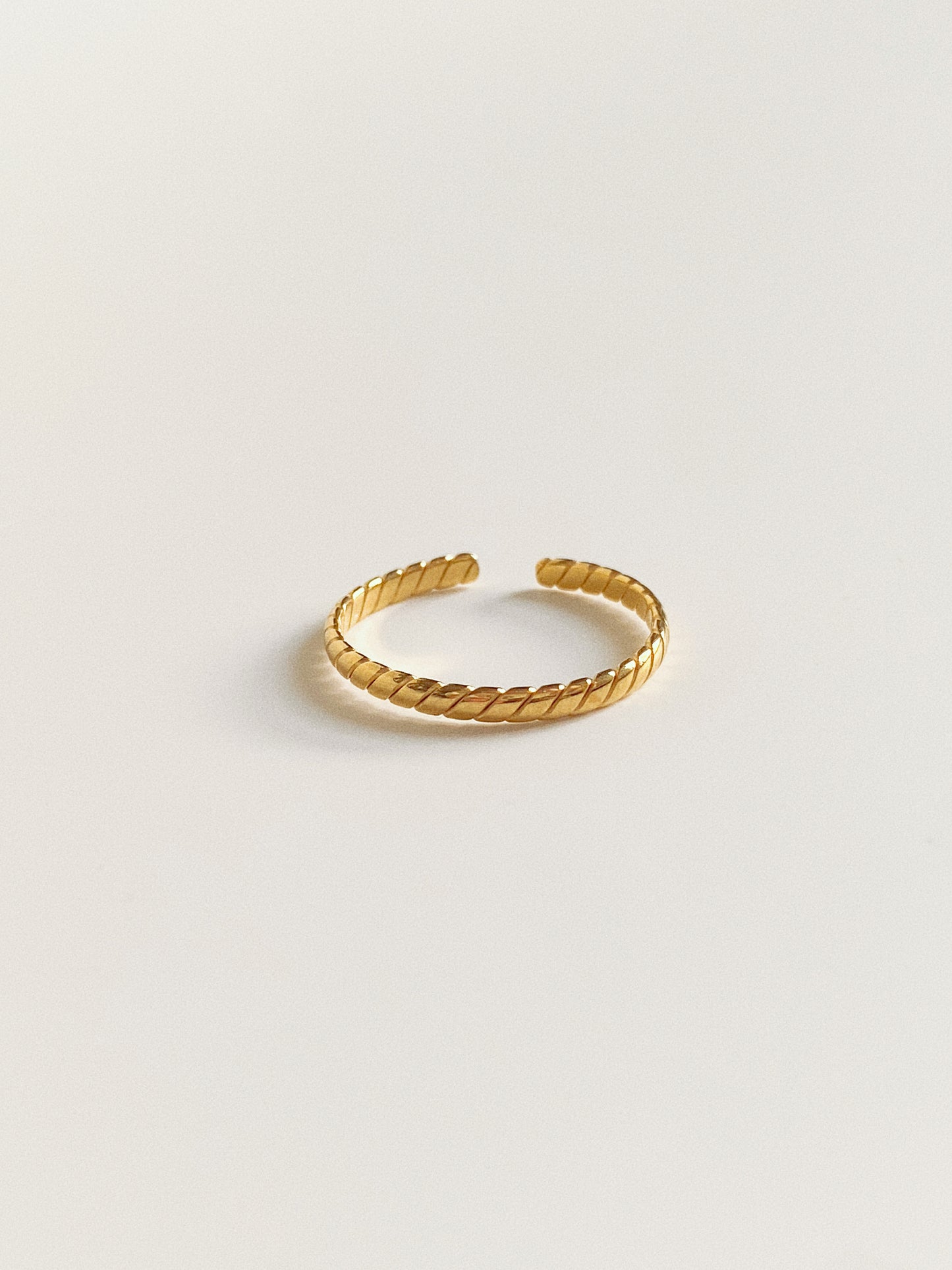 Top view of the narrow slanted stripe ring in titanium steel, showing the high-end artisan texture.