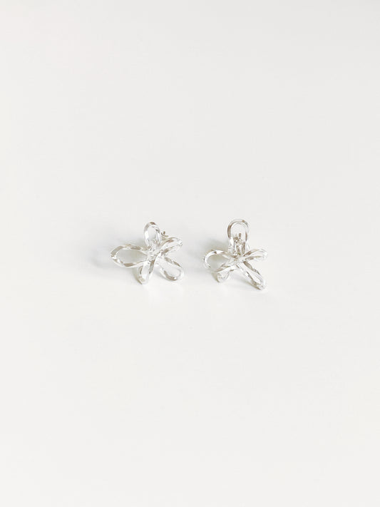 Sculptural wire flower stud earrings in 925 sterling silver flat lay by Deja Vu Jewellery