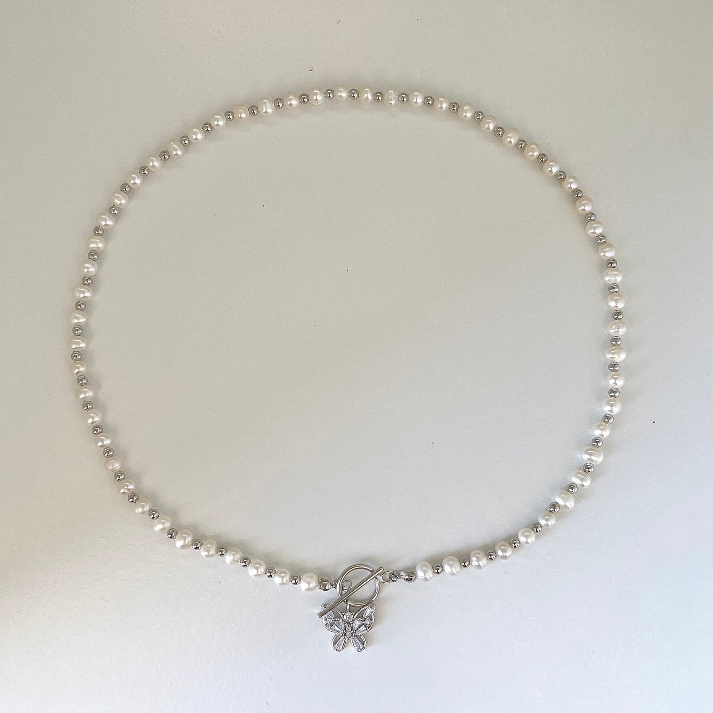 Elegant Pearl Cascade S925 Silver Butterfly Necklace