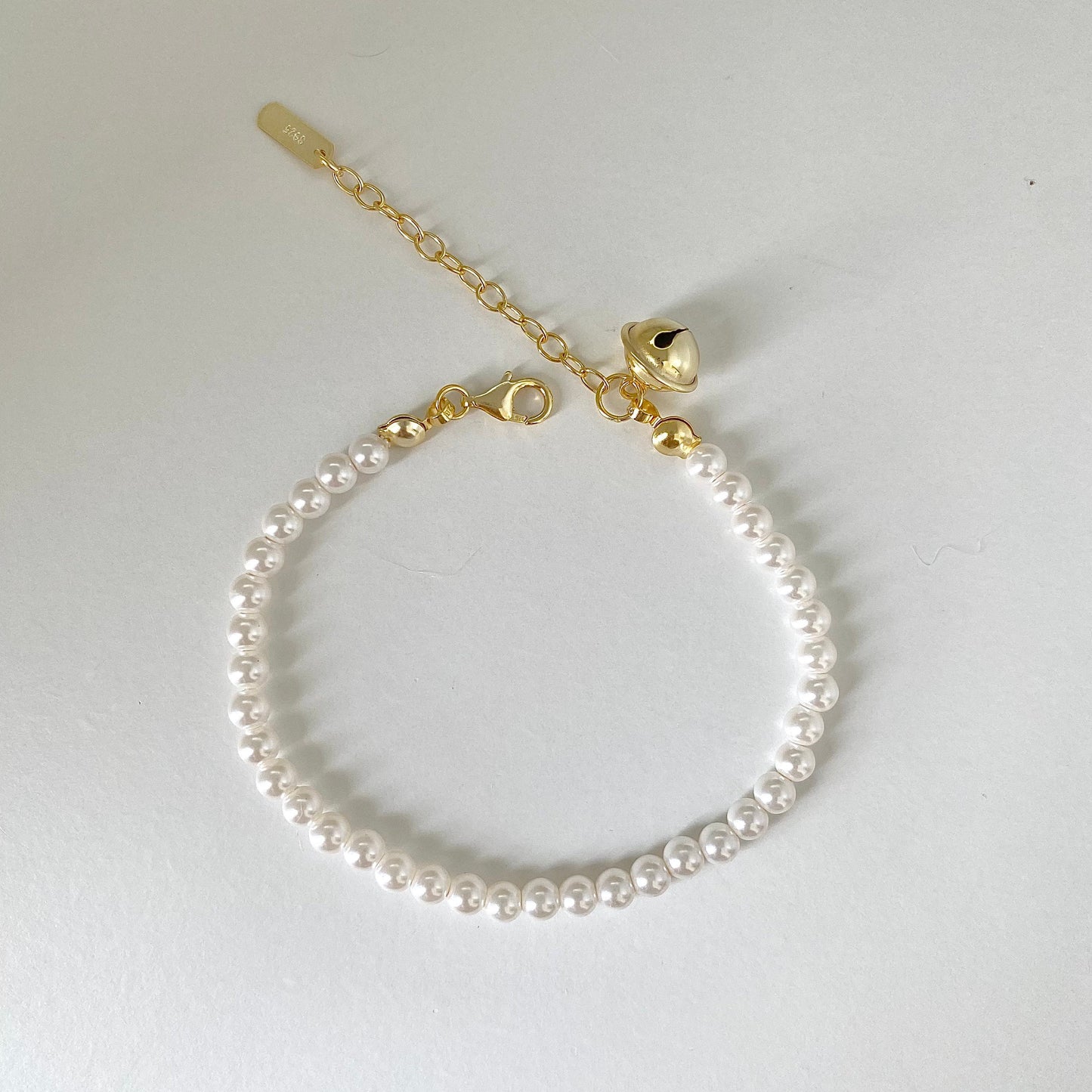 Pearl Melody Swarovski Pearl Bracelet with Gold Bell Charm
